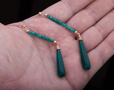 Two tier stone earring,long emerald bead string dangle earring,Nature green chalcedony earring,May birthday gift,anniversary gift,Valentine A pair of two tier natural stone beads / long rod 1. Stone : emerald and green chalcedony (natural gemstones) 2. Stone shape and size: top: a string of emerald bead about 3 mm wide and 37 mm in length, with gold ball stoppers bottom: long green chalcedony rod/club 34 x 7 mm with wire-wrapped cap 3. earring total length ~80 mm 5. wire and earring post: gold p Green Onyx Drop Earrings For Gifts, Green Onyx Gemstone Earrings As Gift, Green Onyx Earrings For May Birthstone Gift, Elegant Jade Earrings With Gemstone Beads, Elegant Jade Gemstone Beads Earrings, Elegant Green Onyx Earrings For Gift, Green Onyx Dangle Earrings Gift, Green Onyx Dangle Jewelry For Gift, Elegant Green Gemstone Beaded Earrings