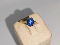 Band: Aarohi Jewellers Material : 14k Yellow Gold Gemstone :Lab Blue Star Sapphire  Blue Sapphire  Stone Weight : 2.20 Ct Blue Sapphire Stone Size : 8x6 mm Gross Weight : 1.400 Gm Style: Minimalist All of our Jewelry is handmade with great care by our team.  Thank you for visiting our store.  https://www.etsy.com/your/shops/Aarohijewellers/tools/listings/create Gold Sapphire Ring Star, Sapphire Gold Ring, Gold Ring Stacking, Star Sapphire Ring, Blue Star Sapphire, Star Sapphire, Ring Stacking, Pretty Jewelry, Fancy Jewellery