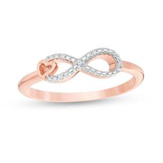 Pretty and petite, this infinity ring is all about shimmer. Created in sterling silver with 14K rose gold plate, this chic choice features a sculpted infinity symbol adorned with diamond accents. A polished heart gleams off-center for a romantic touch. An accessory she'll wear often, this ring is buffed to a brilliant luster. Custom-made to fit her ring size. Sterling silver rings cannot be resized after purchase. Rose Gold Infinity Jewelry With Diamond Accents, Infinity Rose Gold Diamond Ring For Anniversary, Rose Gold Infinity Diamond Ring For Anniversary, Heart Infinity Ring, Heart And Infinity, Halo Engagement Ring Wedding Band, Charm Art, Couple Ring Design, St Michael Pendant