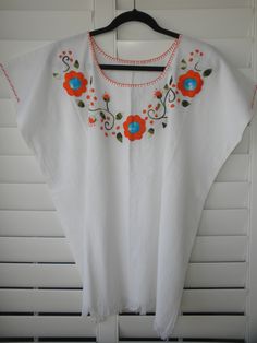 "Width - 30\" shoulder-to-shoulder; Length - 26\" long (Large/Extra Large) 100% Manta (cotton material that wears like a linen). Great for hot weather. Hand-wash or turn inside-out on your machine's delicate cycle Ask me about international shipping!" Orange Embroidered Tops For Summer, Orange Floral Embroidery Short Sleeve Tops, Summer Embroidered Orange Blouse, Orange Cotton Blouse With Floral Embroidery, Orange Floral Embroidered Short Sleeve Tops, Orange Embroidered Summer Blouse, Orange Short Sleeve Tops With Floral Embroidery, Summer Orange Embroidered Blouse, Orange Embroidered Cotton Blouse