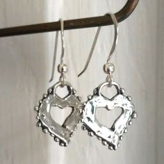 Listing Is For A Pair Of Artisan Sterling Silver Heart Earrings. Handmade, Both Hearts And Earring Hooks Are Solid 925 Sterling Silver. Hearts Measure 17x15mm, With A 1.25-Inch Drop. Earrings Are Gift Wrapped In Eco-Friendly, 100% Recycled Materials That Are Recyclable Themselves. The Photo Of Me Wearing Them Is My Own Personal Pair, But You Will Receive A Brand New Pair. Please Feel Free To Contact Me With Any Questions Or Concerns, And Thanks For Looking! :) Tanzanite Drop Earrings, Sterling Silver Flower Earrings, Sterling Silver Heart Earrings, Pink Pearl Earrings, Silver Circle Earrings, Birthstone Gems, Silver Flower Earrings, Silver Heart Earrings, Mother Of Pearl Earrings