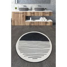 a bathroom with two sinks and a rug on the floor that looks like an oval