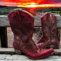 Vintage Old Gringo, Handmade and sewn, brown and red leather, cowboy boot, gorgeous, vintage cowboy boot, unisex, vintage, rare ❤️🔥RARE❤️🔥Old Gringo red flames design on brown distressed leather gorgeous handmade vintage cowboy boot. Gorgeous!! Vintage ❤️ RED AND BROWN COWBOY BOOT  They are gorgeous 🖤❤️ Size Woman 9 1/2 B " narrow to medium width Men Size 7 1/2 narrow to medium width VINTAGE handmade and sewn Old Gringo brown leather and red leather  cowboy boot. Gorgeous. #cowboyboot #oldgringoboots #vintagecowboyboots #vintagecowboy #cowgirlboots #countrymusic #country #countrygirl #countryboy Western Hand Tooled Boots For Festivals, Hand Tooled Western Boots For Festival, Western Boots With Leather Sole For Festival, Western Style Boots With Leather Sole For Festivals, Western Burgundy Leather Boots, Western Red Snip Toe Boots, Western Red Boots With Snip Toe, Red Leather Boots For Ranch, Western Style Boots With Patina For Western-themed Events