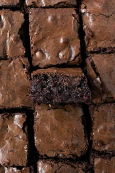 chocolate brownies are stacked on top of each other