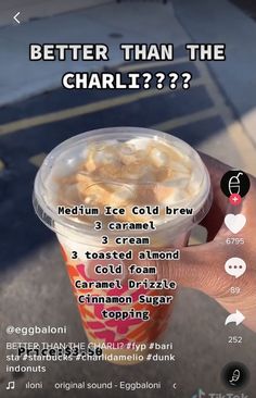 a person holding up a cup of ice cream with toppings on the side and text that reads, better than the challi???????