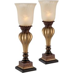 a pair of golden vases sitting on top of each other