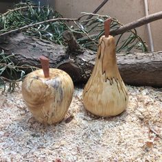 two wooden apples sitting next to each other