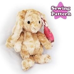 a stuffed bunny rabbit with a pink ribbon around its neck and the words sewing pattern above it