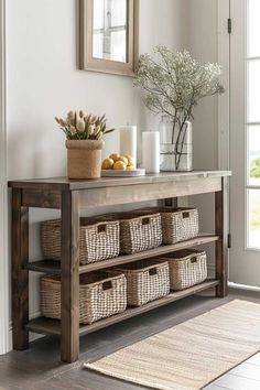 a wooden table with baskets on it and a mirror in the back ground above it