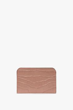 The house’s Envelope Card Holder, reimagined in an exclusive shade of delicate Blush Pink, marries form and function. Crafted in Italy from a textured croc-effect leather, it features three card dividers and a Victoria Beckham stamp and serial number. Envelope Card, Victoria Beckham, Embossed Leather, Emboss, Blush Pink, The House, Card Holder, Envelope, Blush