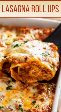 lasagna roll ups in a white casserole dish