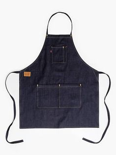 an apron that is made out of denim with two pockets on the front and back