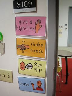 there are five different signs on the door to give a high - five and shake hands