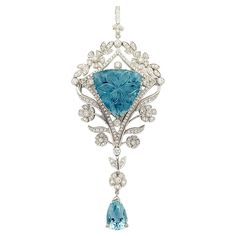 Cabochon Aquamarine 17.97 carats, Aquamarine 2.37 carats and Diamond 1.36 carats Brooch/Pendant set in 18K White Gold Settings (chain not included) Width: 3.5 cm Length: 8.3 cm Total Weight: 16.06 grams "We first opened doors in 1980 when it was then situated in the vicinity of the Victory Monument; a small and modest storefront with a couple of counters. From its humble beginnings to where it stands today, our company has proven its abilities as a jeweler. Since the beginning, we have been supp White Gold Gemstone Brooch Fine Jewelry, Luxury Cabochon Pendant Brooch, Luxury Art Deco Pendant Brooch, Luxury Aquamarine Pendant Jewelry, Luxury Aquamarine Pendant Necklace, Art Deco 1920s, Diamond Brooch, Gold Brooches, Pendant Set