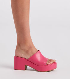 Give off fabulous vibes in these of-the-moment platform mules! They feature an open almond-shaped toe. a wide banded toe strap. an open back for easy on-and-off styling. a platform sole. and a thick block heel. Pair with a quilted handbag.Fit & Features Open almond-shaped toe Wide banded toe strap Open back Platform sole Thick block heel Faux leather material. subtle cushioned insole Runs true to size Spring Platform Slippers With Heel Loop And Round Toe, Trendy Summer Platform Slippers With Heel Loop, Spring Open Toe Platform Slippers With Heel Loop, Summer Chunky Platform Open Heel Mules, Trendy Platform Wedge Slides, Trendy Platform Slides With Wedge Heel, Spring Chunky Platform Synthetic Mules, Trendy Wedge Heel Platform Slides, Chic Platform Slide Slippers