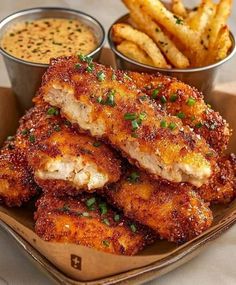 fried chicken and french fries with dipping sauce