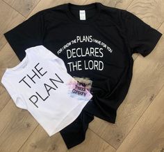 two t - shirts that say, the plan and the plans are on top of each other