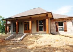 a house that is sitting in the dirt