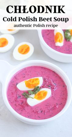 two white bowls filled with soup and topped with hard boiled eggs, garnished with herbs