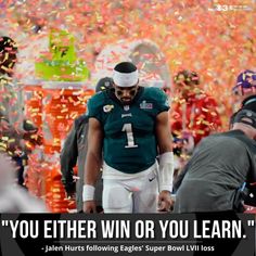 a football player is surrounded by confetti as he walks down the field with his team