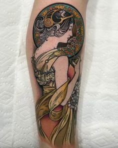 a woman's leg with a tattoo on it