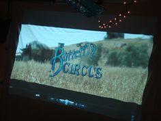 a large screen with the words butterfield circus on it