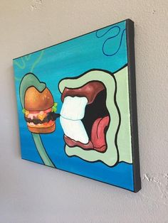 a painting on the wall of a room with a hamburger and an ice cream sandwich