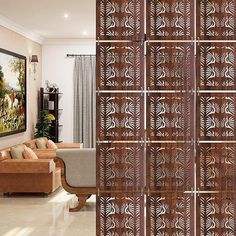 a room divider made out of wood with decorative designs on the doors and side panels