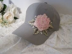 "I designed this adorable grey Youth Toddler baseball cap with a beautiful embroidered Pink Flower. This hat is so cute. These hats are really nice quality. Inside dimensions is approximately 20\" the velcro strap will add 3\" larger or smaller. velcro pony tail back These hats are washed cotton twill. see more youth toddler cadet and baseball hats here: https://www.etsy.com/shop/theraggedyrose?ref=seller-platform-mcnav&section_id=21134612 CUSTOM ORDERS ALWAYS WELCOME.... Will ship in 1 to 2 Gray Baseball Cap For Spring, Gray Cap For Spring, Gray Spring Cap, Gray Snapback Hat For Spring, Gray Cotton Baseball Cap For Spring, Spring Gray Cotton Baseball Cap, Gray Cotton Spring Hats, Spring Gray Cotton Hats, Adjustable Brimmed Gray Baseball Cap