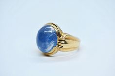 - vintage Art Deco - marked and tested 10k gold - Quartz (PAINTED BLUE) - Quartz measures approx: 16mm x 14mm - size 9 - weighs 10 grams Formal Blue Signet Ring Stamped 14k, Formal Blue Hallmarked Signet Ring, Formal Blue Signet Ring, Formal Blue 14k Gold Signet Ring, Classic Blue Domed Jewelry, Timeless Blue Signet Ring With Polished Finish, Blue Oval Signet Ring Stamped 14k, Blue 14k Stamped Oval Signet Ring, Formal Domed Blue Sapphire Ring