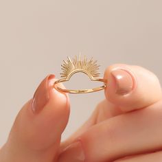 14k Gold Sunshine Ring Bask in the radiant beauty of our 14k Solid Gold Sunshine Ring. This exquisite piece captures the essence of celestial elegance. Meticulously handcrafted, it features a delicate half sunburst design, symbolizing hope and positivity. This dainty sun stacking ring is a perfect addition to your jewelry collection, embodying minimalist charm and timeless style. Ring Details ❥ Gold KT: 14k 18k 10k Solid Gold ❥ Gold Color Options: White, Yellow, Rose Gold ❥ Top Width: 9.25 x 12. Symbolic Rings For Women, Sunshine Wedding Ring, Sun Engagement Ring Gold, Sun Inspired Engagement Ring, Sun Wedding Band, Casual Rings Women, Sun Ring Gold, Adjustable 14k Gold Ring With Halo Detail, Sun Wedding Ring