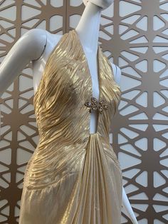 Luxury Gold Evening Dress, Luxury Halter Neck Evening Dress For Gala, Luxury Halter Neck Gala Evening Dress, Glamorous Gold Gown For Gala, Luxury Gold Evening Gown, Luxury Halter Neck Evening Dress For Wedding, Luxury Gold Floor-length Evening Dress, Luxury Gold Evening Dress With Fitted Bodice, Gold Backless Evening Dress