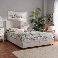 a bedroom with a bed, dressers and chair in it's center area