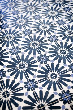 a blue and white tile pattern on the floor