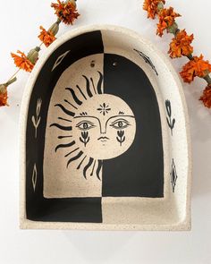 a ceramic dish with an image of a woman's face on it