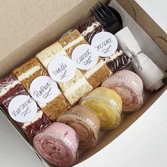 a box filled with different types of desserts