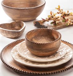 wooden bowls and plates on a table