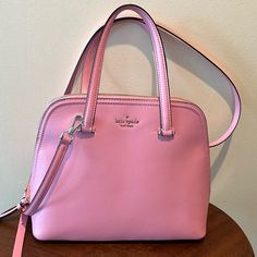 Kate Spade Dome Top Satchel Crossbody Bag Handbag Shoulder Bag Purse Nwot New Without Tags No Callouts No Flaws Powder Pink Genuine, Leather Goldtone Hardware & Accents Adjustable & Removable Crossbody Strap +\-3” Front Has Pin Mount Kate Spade New York In Goldtone 4 Goldtone Feet On Bottom Zipper Top Closure/Matching Leather Pull Clean Interior Lined In Powder, Pink/ Imprint Inside Contains 1 Zippered Pocket/Leather Pull Below Is Kate Spade New York Imprinted In Gold Foil On Leather Patch 2 Sli Kate Spade Pink Purse, Wallet Pouch, Zipper Top, Leather Pulls, Powder Pink, Leather Patches, Kate Spade Bag, Crossbody Strap, Kate Spade New York