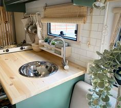 a kitchen with a sink and window in it