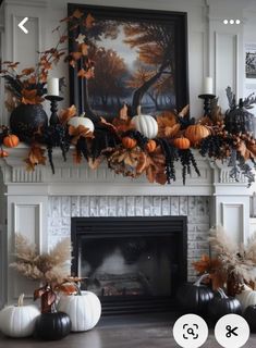 a fireplace decorated for fall with pumpkins and other decorations on top of the mantle