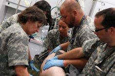 several soldiers are doing surgery in the hospital