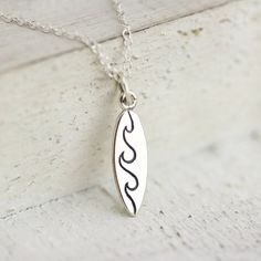 Surfboard charm necklace. Her first surfboard, first surf lesson or a passion for surfing, this cute keepsake gift will remind her every day of the fun and adventure of that time. Shop keepsake jewelry and keepsake gifts for women at www.tnineandco.com #TNine #giftsforher #necklace Surfing Jewelry, Friends At The Beach, Surf Necklace, Surfer Jewelry, Surf Jewelry, Beachy Jewelry, Gifts For Surfers, Charm Necklaces, Keepsake Jewelry