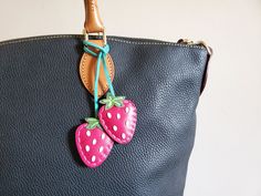 "Strawberry handbag charm, Fruit lover gift, Kawaii fruit charm, Pink leather handbag décor, Fruit keychain, Summer keychain Charms add a touch of playfulness to your bag, especially when the design is too serious or gets boring. It also gives your bag a different look - a personality. So when you meet a friend who has the exact same bag you have, yours will give a different impact.  This fruit charm is beautiful and colorful. The leaf is made from suede and the fruit body is from leather. It's Cute Pink Bag Charm For Everyday Use, Cute Pink Everyday Bag Charm, Cute Rectangular Bag Charm For Gift, Fruit Keychain, Foil Tags, Kawaii Fruit, Red Leather Handbags, Holographic Foil, Chunky Jewelry