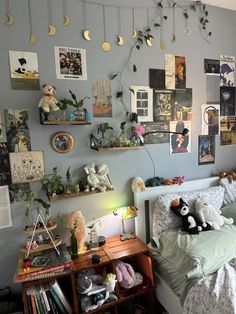 a bed room with a neatly made bed and lots of pictures on the wall