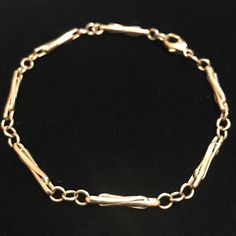 This Is A Solid 14 Karat Gold Bracelet With European Hallmarks 585, An Anchor, A Scale With 585, And A G In A Box And Another G, Or An O In A Box. So G G Or G O In Individual Boxes. It Weighs 6.3 Grams And Is 7 3/4” End To End. The Design Of The Links Is Gorgeous. It’s Not Your Average Gold Chain. The Comps Are Up There. Excellent Preowned Condition. Elegant Sterling Silver Bangle Bracelet With Lobster Clasp, Elegant Sterling Silver Bangle With Lobster Clasp, Elegant Gold Link Bracelet With 17 Jewels, Formal Gold Bracelet With Lobster Clasp, Formal Gold Bangle Bracelet With Lobster Clasp, Elegant Gold Bracelet With Lobster Clasp, Elegant Gold Bracelet With Lobster Clasp For Anniversary, Elegant Gold Bracelet With Spring Ring Clasp, Elegant Link Bracelets For Formal Occasions