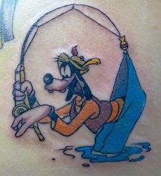 a cartoon character holding a fishing rod on the back of a woman's shoulder