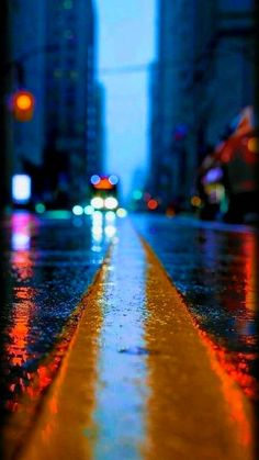 an image of rainy city street at night