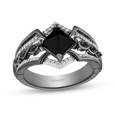 a black diamond ring with white diamonds on top and the words disney written in silver