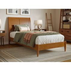 a bed sitting on top of a wooden frame