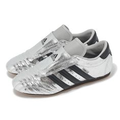 a pair of silver and black shoes on a white background with the words adidas